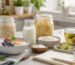 Gut health foods with yogurt kefir oats ginger tea and fermented vegetables